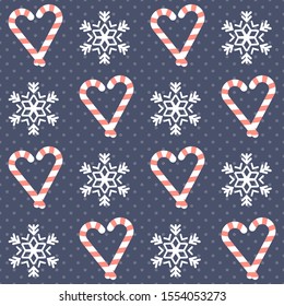 Christmas pattern. Seamless vector illustration with heart-shaped candy canes and snowflakes