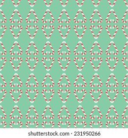 Christmas pattern with stripped  candies, arranged as hearts