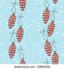 Christmas pattern with Christmas toys on a blue background with snow. Vector