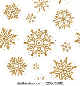 Christmas pattern. Vector seamless pattern with golden glitter snowflakes on a white background