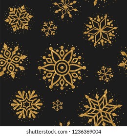 Christmas pattern. Vector seamless pattern with golden glitter snowflakes on the black background