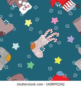 Christmas patterns, for packaging, fabrics, wallpaper in the form of boots, festive red boots, socks, candy, berries, stars, against a dark turquoise background.