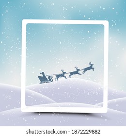 Christmas photo frame and Santa flies from snowdrift in blue sky. Winter hills and falling snow. Holiday snapshot template in nature backdrop