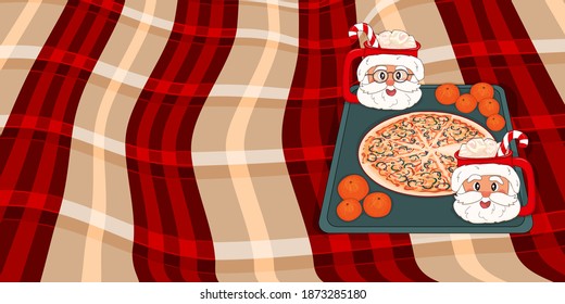 Christmas Pizza with Santa Claus Cups with cocoa, marshmallows, candies, tangerines on a tray on red beige plaid