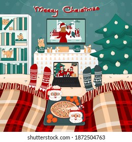 It is Christmas pizza time with cocoa with marshmallows at home. Two people have a video call with friends. There are TV set, bookcase, tree, bed with plaid, toys, gifts in the room
