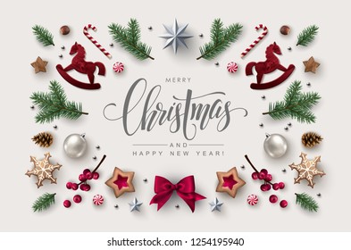 Christmas postcard with Calligraphic Season Wishes and Composition of Festive Elements such as Cookies, Candies, Berries, Christmas Tree Decorations. Flat lay, top view.