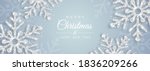 Christmas poster with shiny silver snowflakes on a white background. Vector illustration