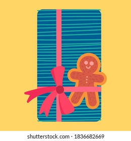 Christmas present from above flat vector illustration. Wrapped gift box with gingerbread cookie