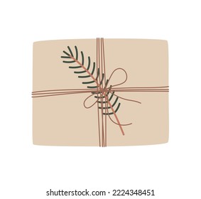 Christmas present in kraft paper with wisted rope and fir twig. Rustic gift box