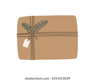 Christmas present in kraft paper with wisted rope and fir twig. Rustic gift box