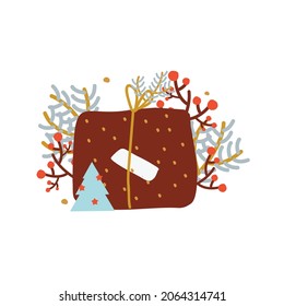 Christmas present. New Year giftbox decorated with spruce, berries, forest branches, leaves for seasonal winter celebration design