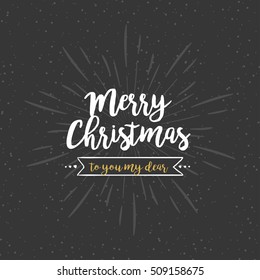 Christmas quote in gold and white at dark vintage background