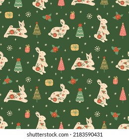 Christmas rabbit pattern. New Year 2023 seamless background, textile, fabric design. Vector print with rabbits, hare, gifts, Christmas tree, flowers, snowflakes. Cute illustration of floral rabbits.