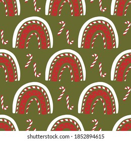 Christmas rainbow and lollipop vector seamless pattern. Trendy traditional nursery kids background. Festive cute winter holiday print for children.