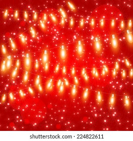 Christmas red background with lights garlands sparkle light