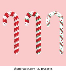 Christmas red, green, and white color candy cane set design on a pink background. Set of Christmas candy for card decoration. Christmas candy cane vector design collection for kids. 