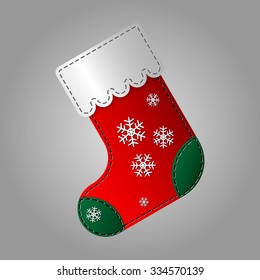 Christmas red, green and white sock with snowflakes on a light gray background