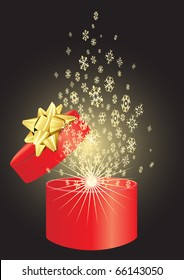 Christmas red present with golden snowflakes on a black background