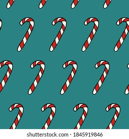 Christmas red and white candy cane on a blue background. Geometric endless candy texture.