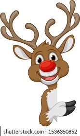 Christmas reindeer with big red nose cartoon character peeking around a sign and pointing at it