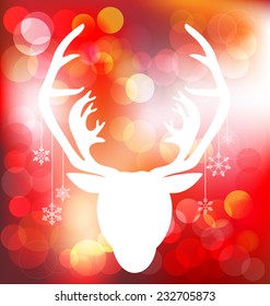 Christmas reindeer on red bokeh background