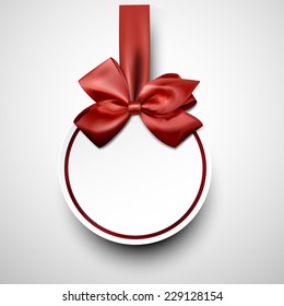 Christmas round gift card with red ribbon and satin bow. Vector illustration. 