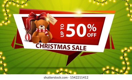 Christmas sale, up to 50% off, red discount banner in the form of geometric plate with present with Teddy bear