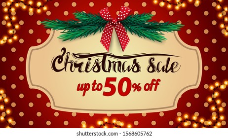 Christmas sale, up to 50% off, red discount banner with polka dot texture, vintage frame, christmas tree and red bow