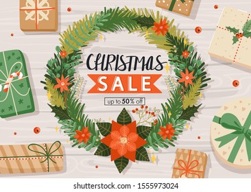 Christmas sale banner. Design with gifts, floral wreath, berry and stylish lettering on wood background. Vector illustration for website, poster, coupons, invitation card.