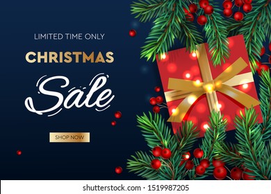 Christmas Sale banner. Realistic fir-tree branches with berries and red gift box. Vector illustration for winter holiday discounts