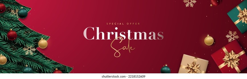 Christmas sale banner. Realistic Christmas tree branches with balls, snowflakes and gift boxes. Winter holidays discounts. 