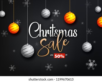 Christmas sale with best offers,  decorative gift boxes, stars and baubles on red, gray texture background.