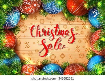 Christmas sale design with balls, garland and fir tree. Shiny winter background. Calligraphy. Lettering. Vector illustration. 