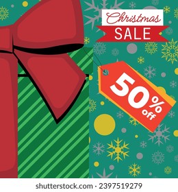 Christmas Sale Green Gift Box With Red Ribbon With Tag 50% Off and Gold Silver Snowflakes and Balls in Background