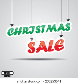 Christmas Sale Hanging On Gray Background. Vector.