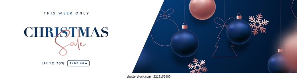 Christmas Sale header banner. Luxurious design of hanging blue and rose gold Christmas balls and snowflakes. Xmas balls motion blur effect.