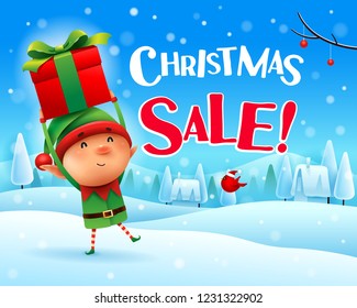 Christmas Sale! Little elf holds up gift present in Christmas snow scene winter landscape.