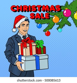 Christmas Sale. Pop Art Man in Santa Hat with Gifts and Fir Tree. Vector illustration