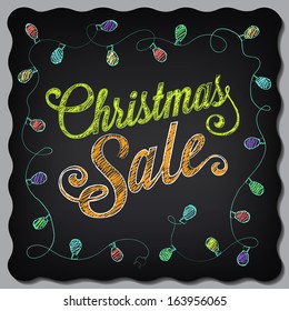 Christmas sale poster drawing with chalk on the blackboard