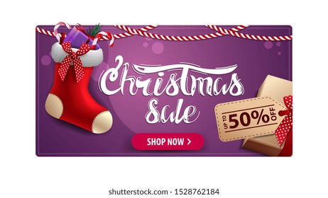 Christmas sale, purple discount card with gift with price tag and Christmas stockings