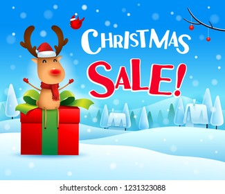 Christmas Sale! The red-nosed reindeer sit on gift present in Christmas snow scene winter landscape. 