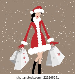 Christmas sale. Shopping fashionable woman in red christmas dress. Hands full of shopping bags.