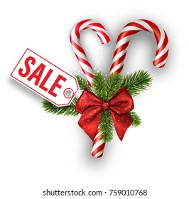 Christmas sale tag with candy canes and red bow on white. Vector illustration.