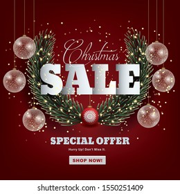 Christmas sale template with Christmas ornaments, light bulb and fir branches.