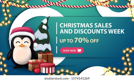 Christmas sales and discounts week, up to 70% off, blue discount banner with white decorative rings, garlands and penguin in Santa Claus hat with presents