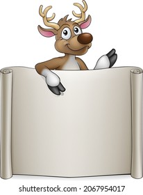 A Christmas Santas reindeer cartoon character peeking over a blank sign with copyspace