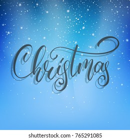 Christmas. Christmas script lettering on the snow winter background. Winter holiday card with snowflakes and calligraphy.