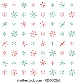 Christmas seamless background with random scatter falling red and green snowflakes isolated on white.
