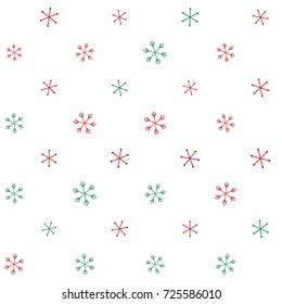 Christmas seamless background with random scatter falling red and green snowflakes isolated on white.
