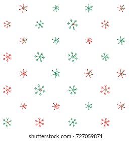 Christmas seamless background with random scatter falling red and green snowflakes isolated on white.